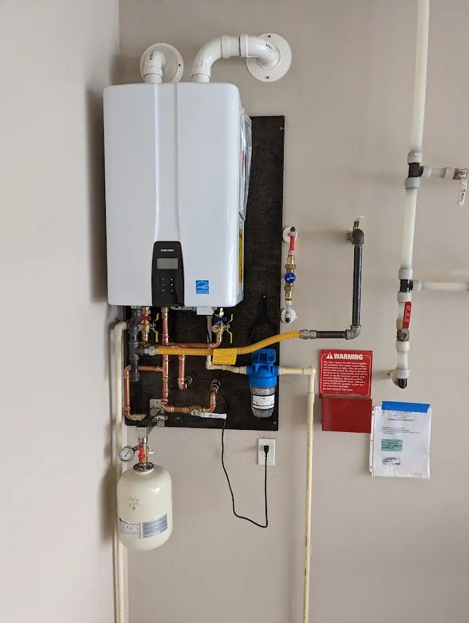 Professional plumber installing copper piping in a Galveston home